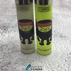Two gray and yellow Clipper lighters with ninja stick figures made in Spain.